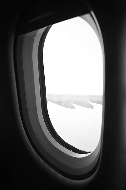 istock cloudscape of window at flying airplane 477528502