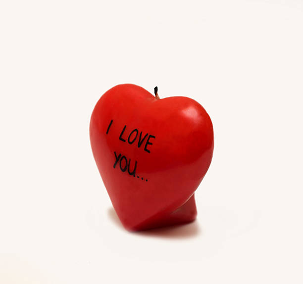 istock candles in the shape of a heart 477528895