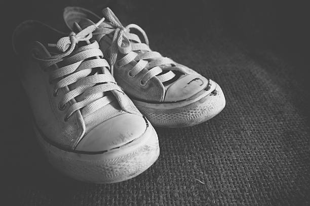 istock Old black and white sneakers 477529618