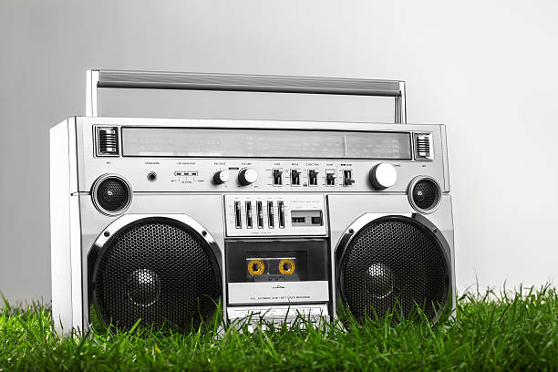 1980s Silver radio boom box  on green grass stock photo