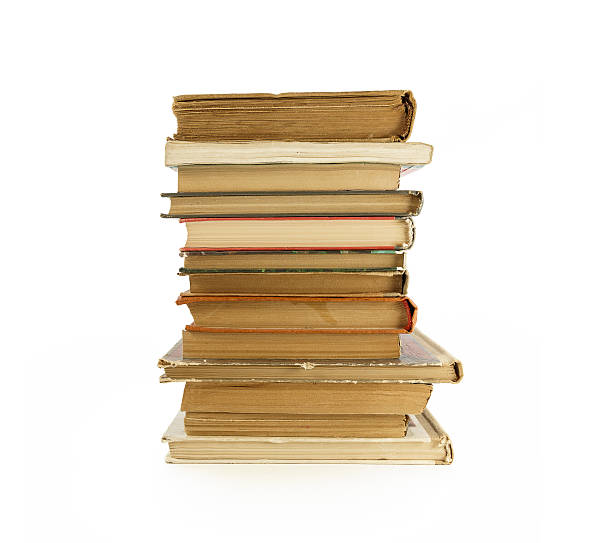 istock Old, yellowed books on a white background 477533162