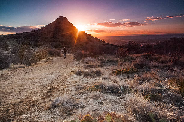 istock mountain biking sunshine landscape 477537401