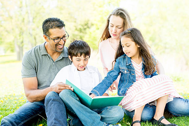istock Family Reading in the Park 477538466