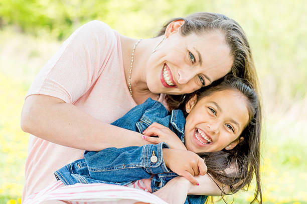 istock Mother and Daughter Laughing Together 477538476