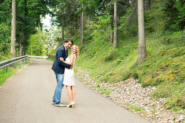 istock Beautiful young couple on street in forest 477539663