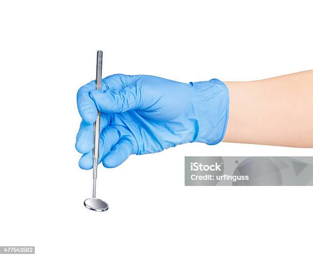 Hand In Blue Glove Holding Dental Tool Isolated On White Stock Photo - Download Image Now