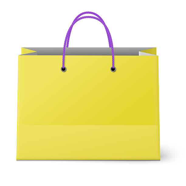 istock Classic shopping yellow bag with violet grips isolated on white 477543762