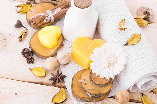 istock candle, cinnamon with towel on wood 477544824
