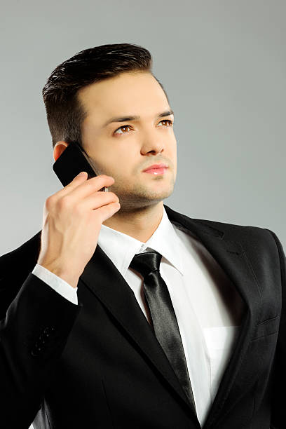 istock business man with phone 477544923