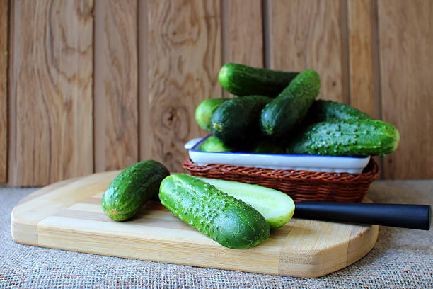 istock Cucumbers, lying on a board for the preparation of salad. 477545544