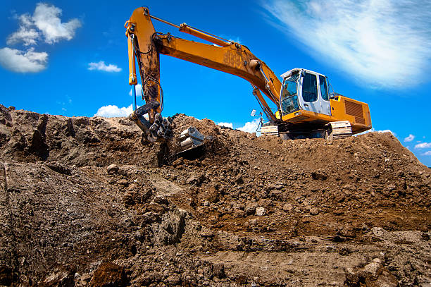 istock industrial excavator bulldozer in sandpit with raised bucket 477546279