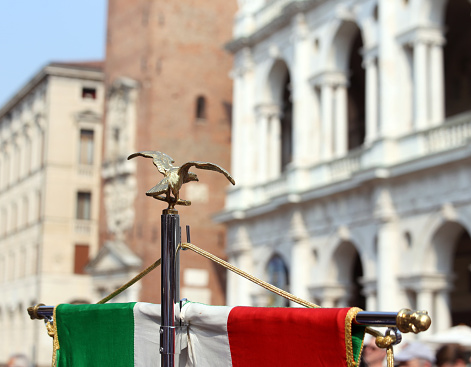 italian flag of army musical band and the Palladian Basilica in Vicenza