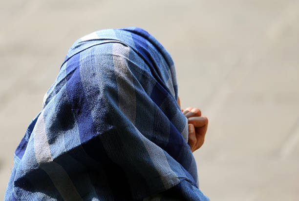 istock Arab woman with veil in town 477546902