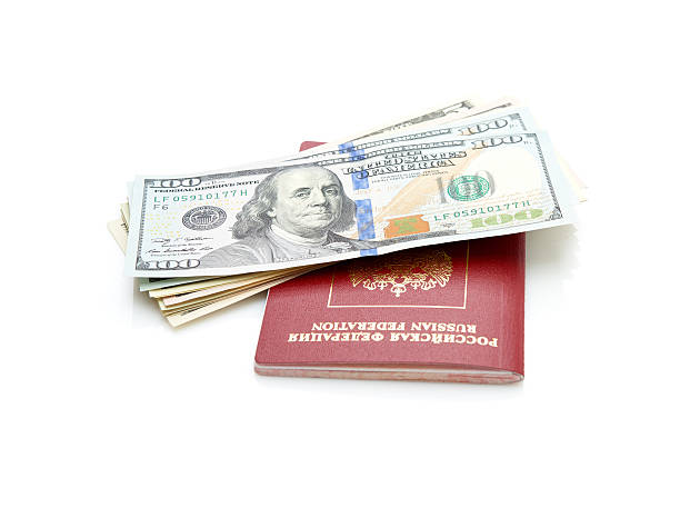 istock Russian passport with American dollars 477548326