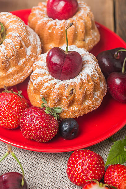 istock Homemade muffins with fresh berries 477548466