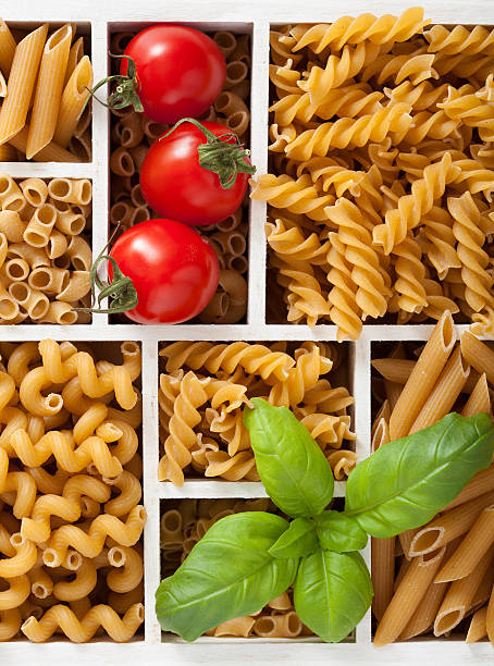 istock various raw wholegrain pasta in white wooden box 477549012