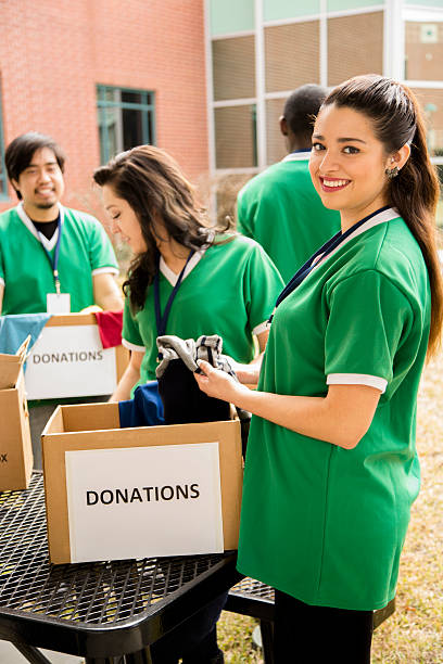 istock Volunteers: College students collect clothing donations for community. 477549225