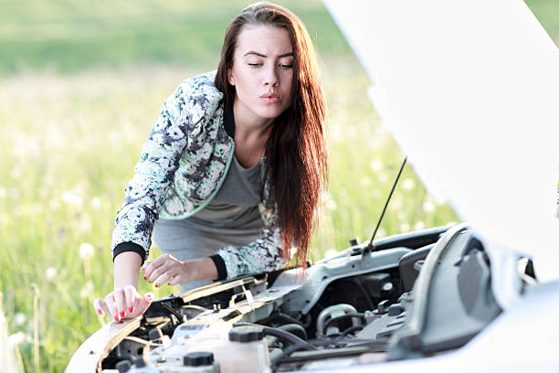 istock attractive brunette in front of her car 477549358