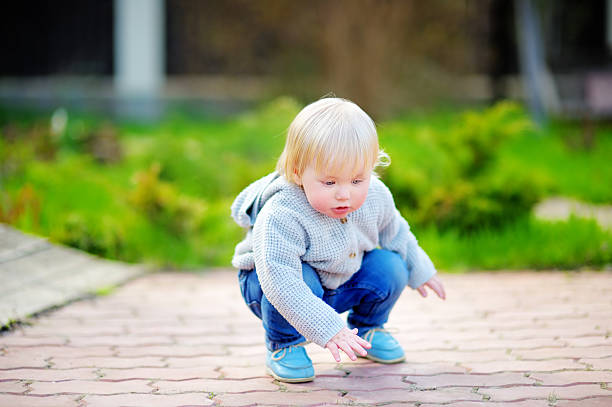 istock Toddler boy playing outdoors 477549806
