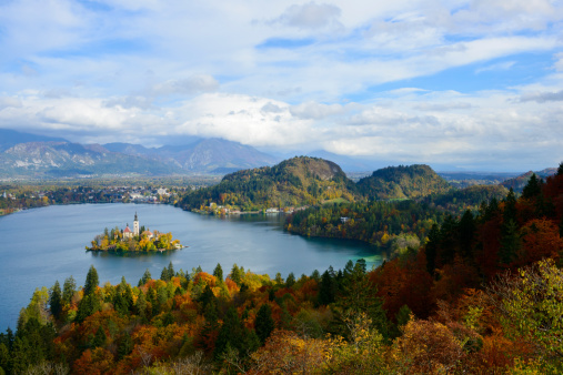 Autumn landscape over Lake Bled, Slovenia. Bled Island and the Church of the Assumption visible on the lake.