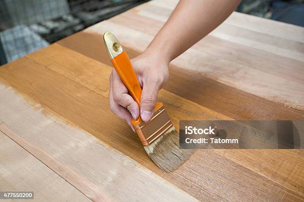 Applying Protective Varnish On A Wooden Furniture Stock Photo - Download Image Now - Furniture, Wood - Material, 2015