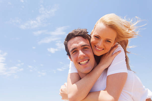 istock young man carrying girlfriend on his back 477550725