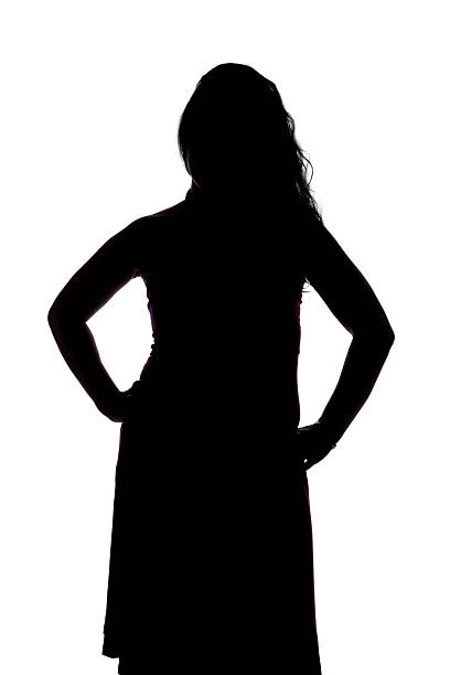 istock Silhouette of curvy woman with hands on hips 477554088