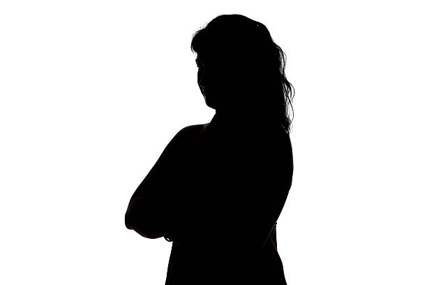 istock Silhouette of smiling woman 477554090