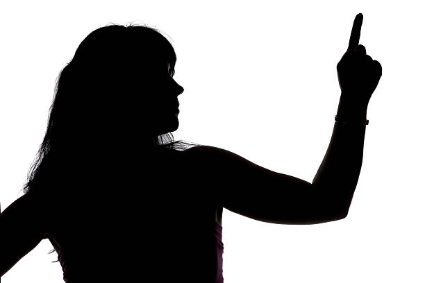 istock Silhouette of showing up woman, left side 477554392