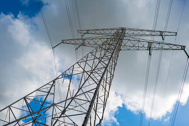 istock Electric power transmisson in a blue cloudy sky 477555574