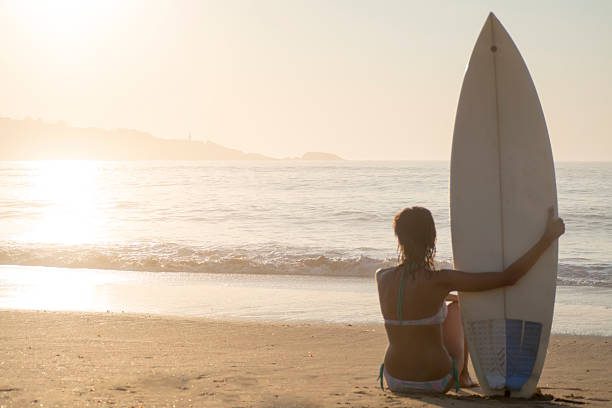 istock Surfer girl sunset 477555584