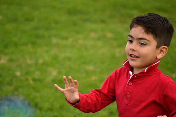 istock Child playing in the park 477556263