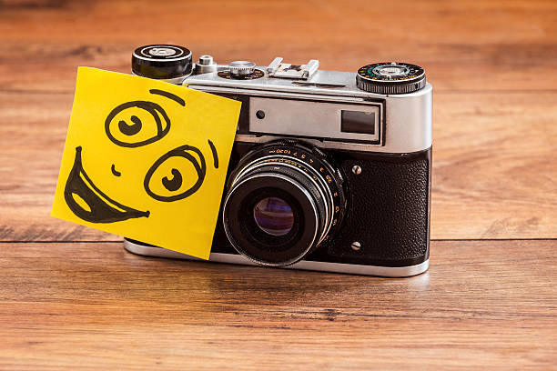 Close-up ofretro camera with adhesive note on it