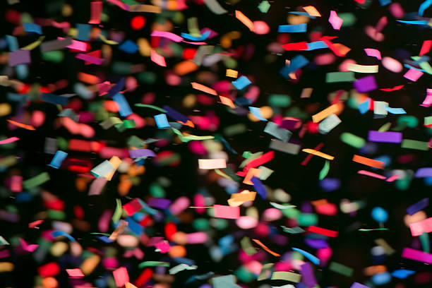 istock Colorful streamers on black background 477557597