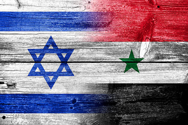 istock Israel and Syria Flag painted on old wood plank texture 477560207