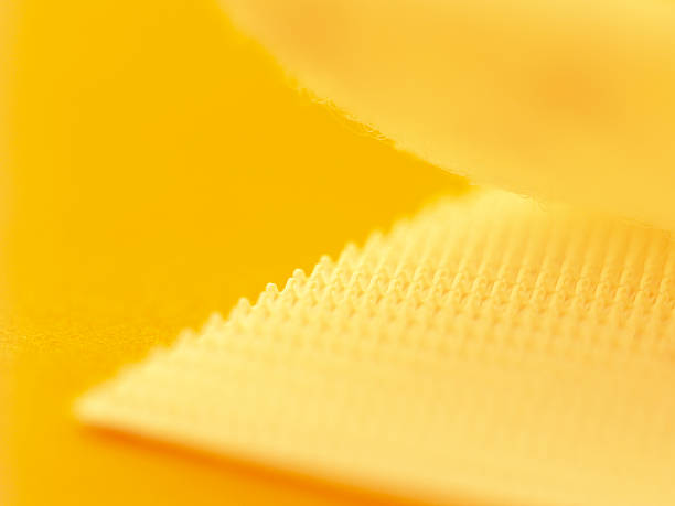 Velcro Close up of velcro with a yellow hue nylon fastening tape stock pictures, royalty-free photos & images