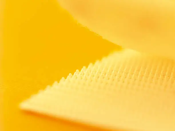 Close up of velcro with a yellow hue