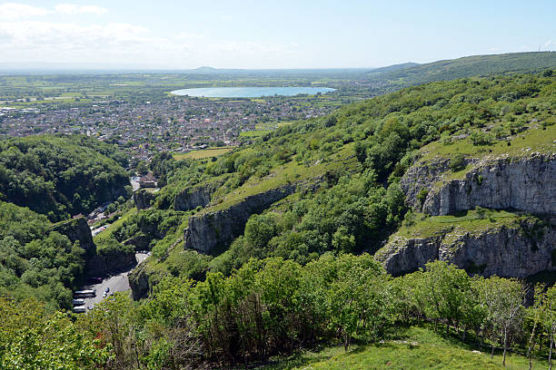 Cheddar Gorge and town The town of Cheddar and the Gorge that makes it famous. Popular tourist destination. cheddar gorge stock pictures, royalty-free photos & images