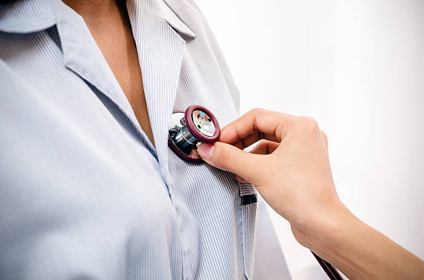 istock doctor listening to patient’s heart 477561534