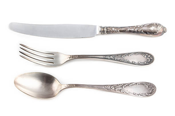 istock Image of antiquarian silver fork, spoon and knife 477561648