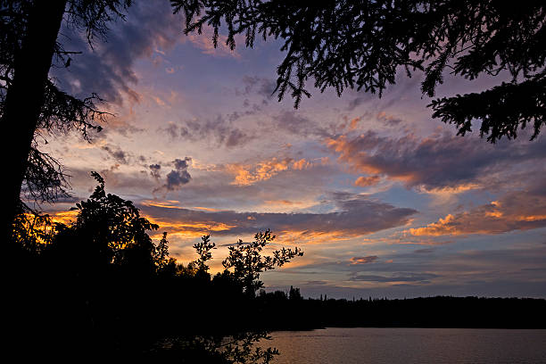 Ness Lake Sunset These days when you are visiting an unfamiliar area all you need to do is access Google Maps on a smart phone. If you have the time you can find yourself an interesting location which might just give you a nice forground for a fantastic sunset. prince george photos stock pictures, royalty-free photos & images