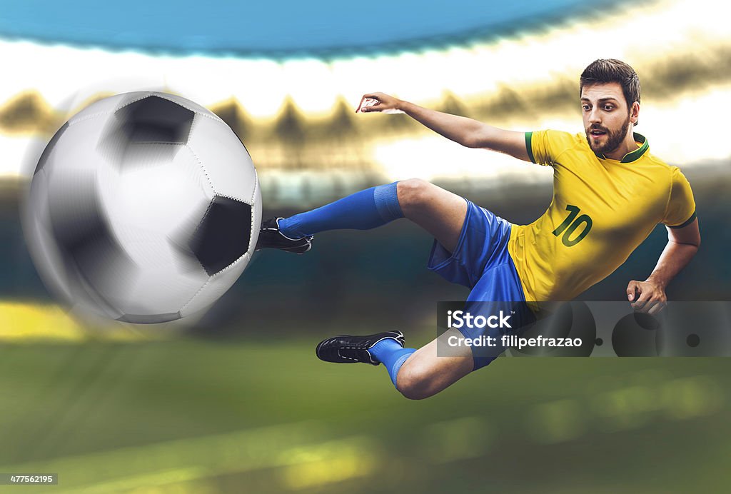Brazilian soccer player kicks the ball on stadium 2014 Stock Photo