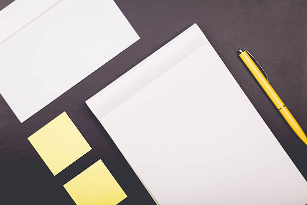 istock notepad with yellow pen and stickers 477562894