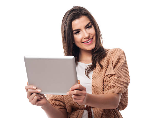 istock Beautiful woman holding digital tablet 477563061