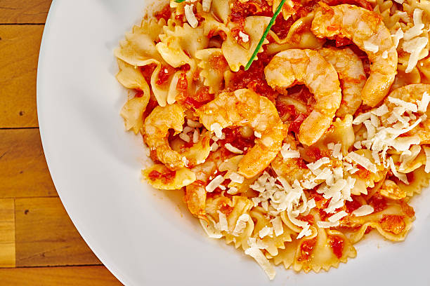 istock Farfalle with rustic tomato sauce and shrimp 477564200