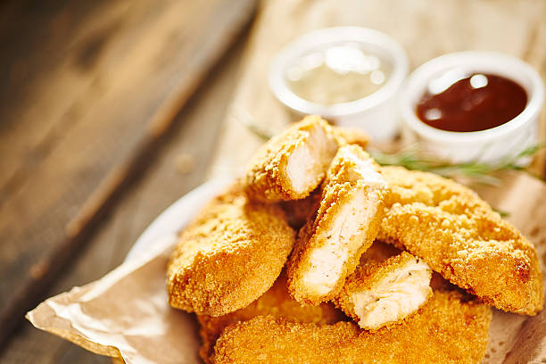 Fried chicken fillet with barbecue sauce and tartar sauce