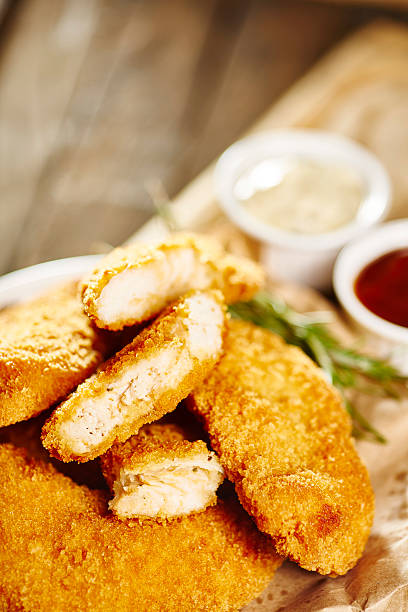 istock Fried chicken fillet with barbecue sauce and tartar sauce 477564204