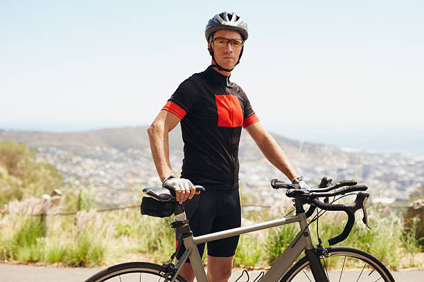 istock Male athlete taking a break after cycling training session 477567320