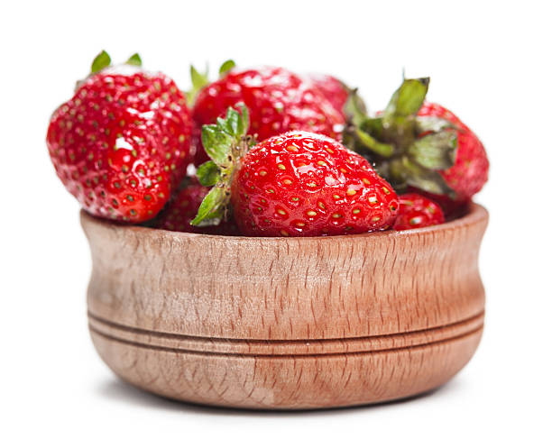 istock strawberry in wooden bowl 477567484