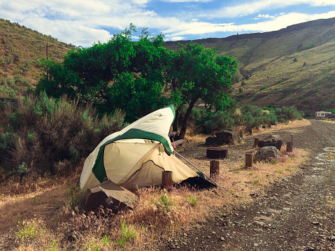 An abandoned damaged tent in Central Oregon was left by it's owner after a severe wind storm in the Deschutes River Canyon wild and scenic area.